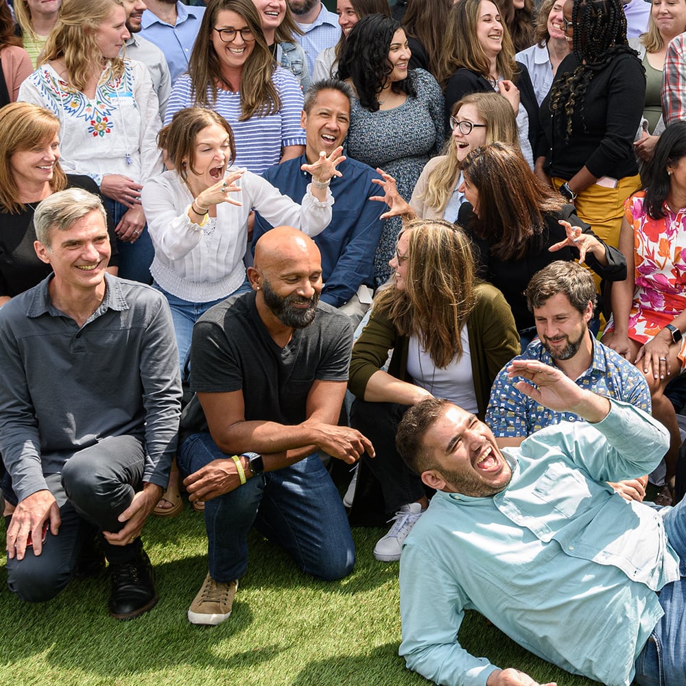 WellRight employees outside laughing during a group photo