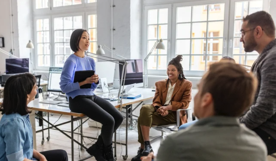 professional-group-sitting-in-office-having-conversation